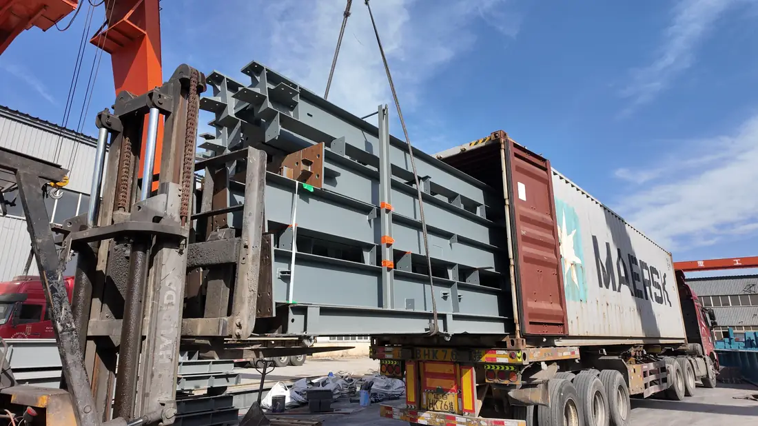 Loading steel structure into container