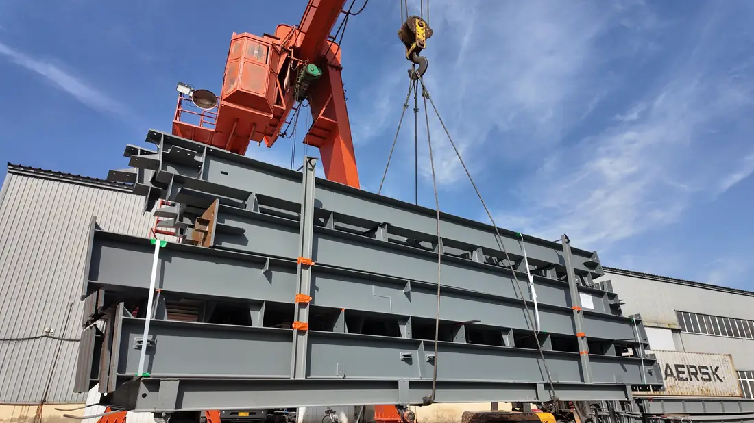 Steel structure bundle lifted by gantry crane